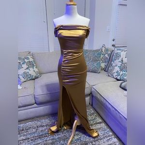 New long golden dress. Never been worn. Off the shoulder sleeves.